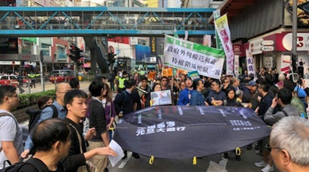 Thousands in Hong Kong protest Beijing's interference